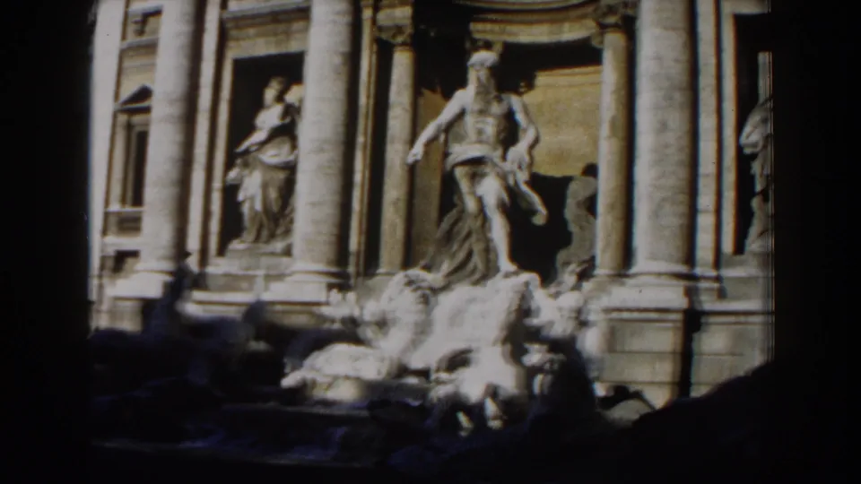 1959 Rome 8mm view of Trevi Fountain marble statuary, columns, niches, and fountain rockwork under daylight.