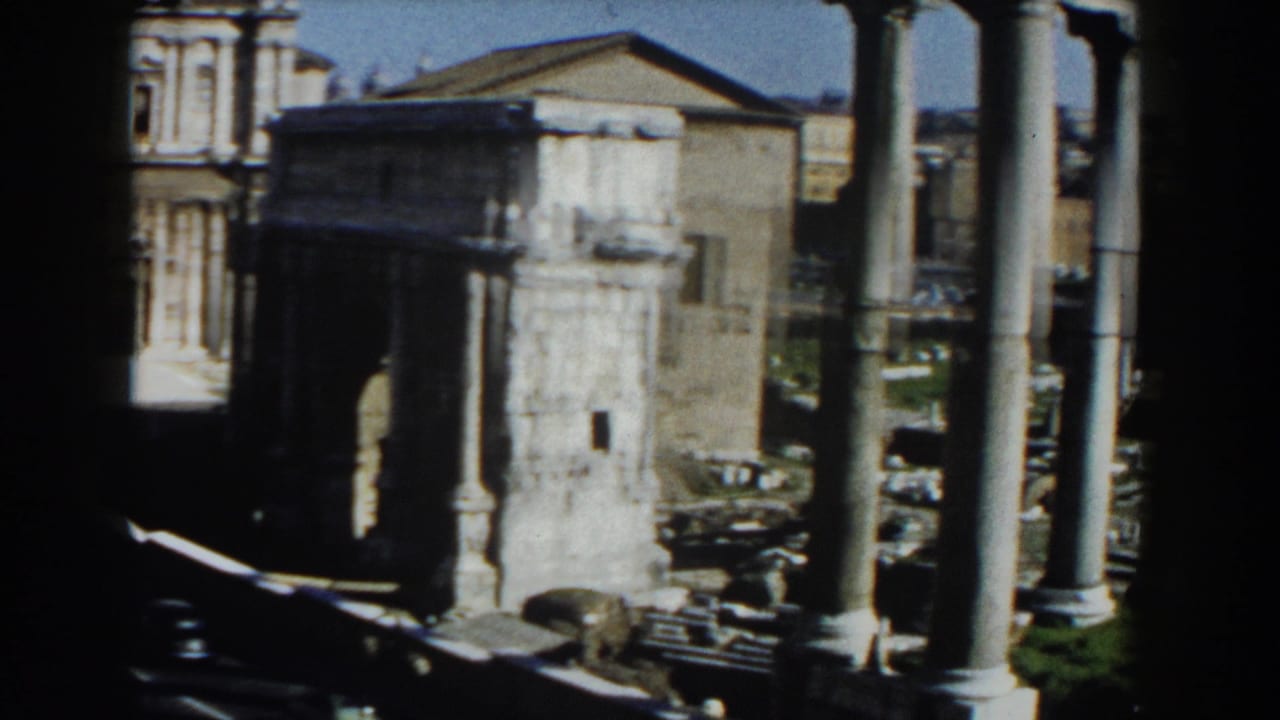 Classical columns and weathered stone ruins seen through dark 8mm frame edges.