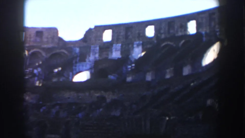 Rome Colosseum interior wall seen through dark 8mm frame edges, with arched openings and worn stone tiers.