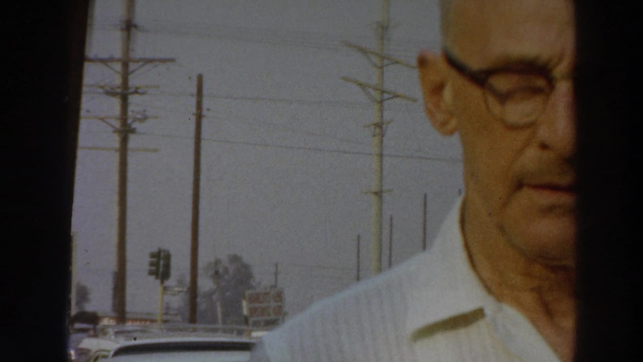 A cropped close view shows the man in glasses at the edge of the frame, with Puerto Rico roadside poles and cars visible behind him in 1966 footage.