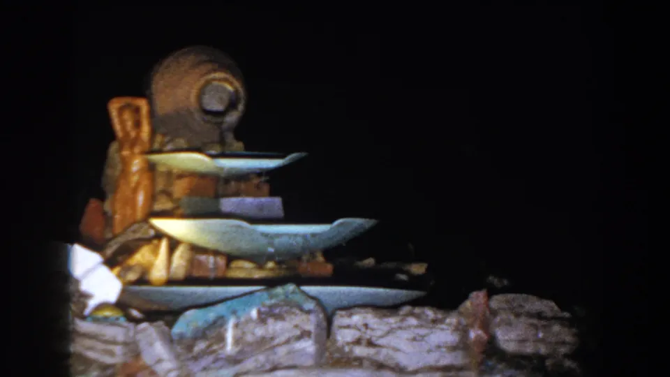 The 8mm frame shows a closer view of the tiered fountain or serving display in the Brighton, Michigan clip.