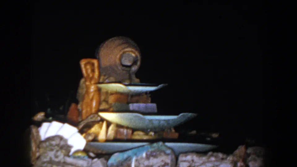 The tiered decorative display remains centered in the final 1960 Brighton, Michigan home-movie frame.