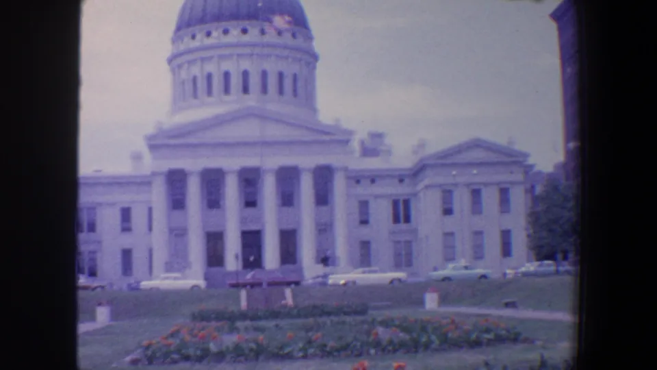 Saint Louis landmark footage from 1964 shows the domed civic building front, lawn, parked cars, and public landscaping.