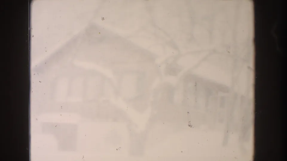 Hazy 1961 Dearborn winter frame with pale snow, faint house forms, bare branches, dust, and dark 8mm gate edges.