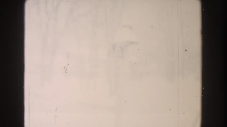 Overexposed-looking 8mm winter frame from the Dearborn clip, with faint bare trees and a barely visible snow-covered post in the snow.