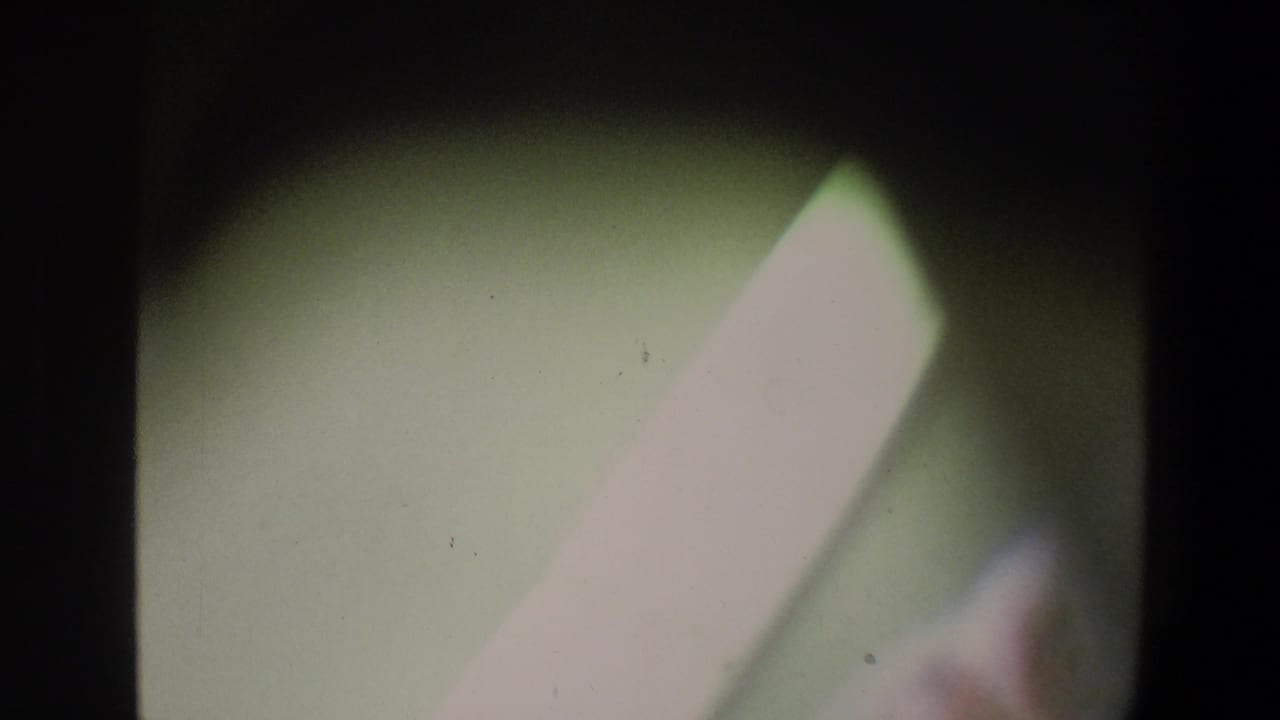 Dim 8mm frame with a pale diagonal shape, soft green background, and heavy dark border.