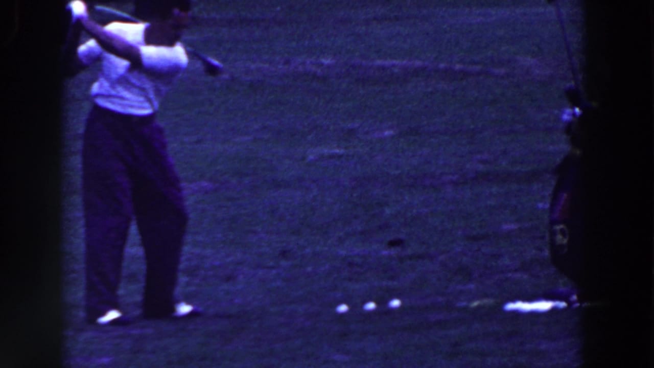 In Ridgefield, New Jersey home-movie footage from 1961, a man in a white shirt swings a golf club on grass.