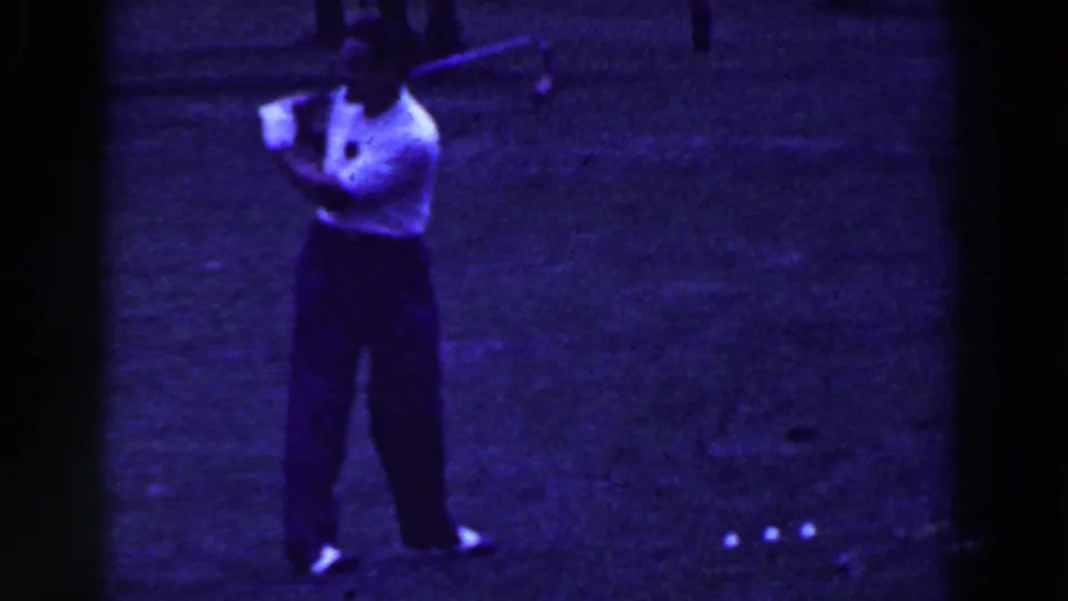 A closer 8mm frame shows the man mid-swing, with several golf balls visible on the grass in front of him.
