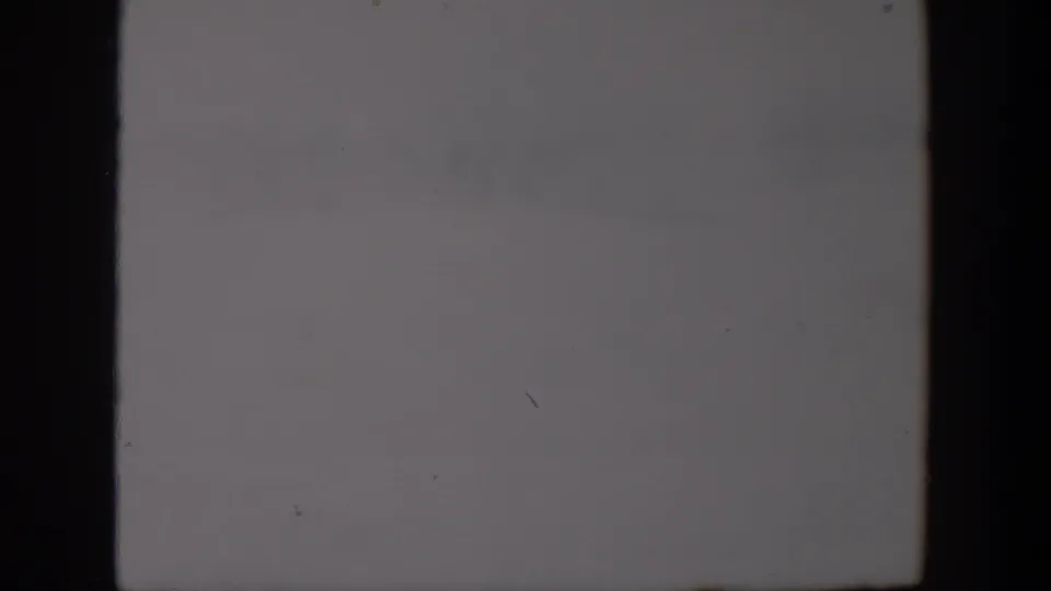 The final 1957 Lubbock frame is mostly pale snow and faint background texture, with the action nearly outside the visible area.