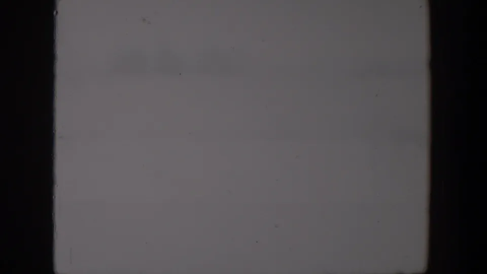 Cloudy sky in the Lubbock 1957 home-movie footage, showing muted gray tones and light film wear.
