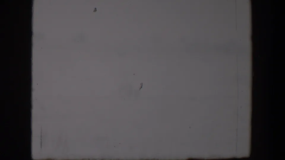 Final sampled frame of the Lubbock 1957 cloudy-sky clip, showing gray cloud cover and light 8mm film artifacts.