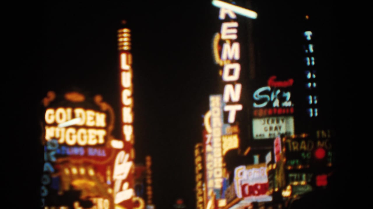 Night neon signs with Golden Nugget, Lucky, Remont, and Sky visible.