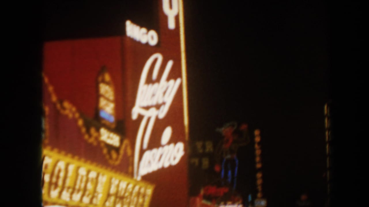 Lucky Casino neon script and Golden signage glowing at night.