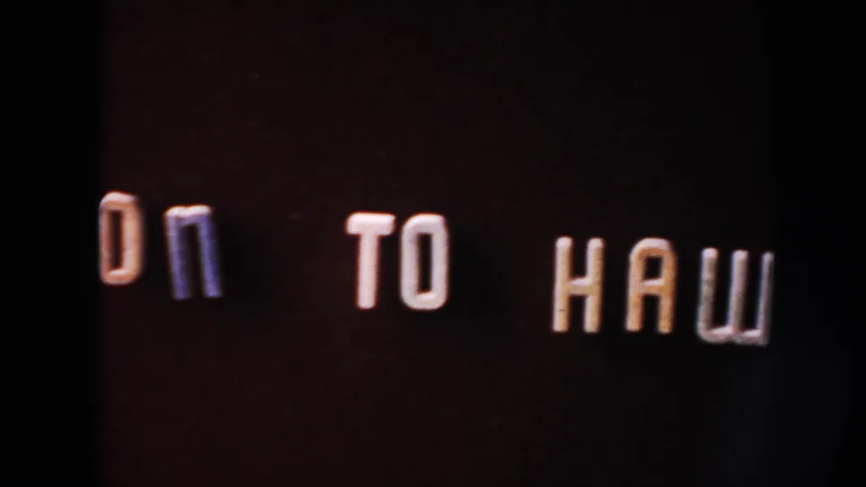 Home-movie title card begins the phrase ON TO HAWAII, with raised white letters partly cropped by the contact-sheet frame.