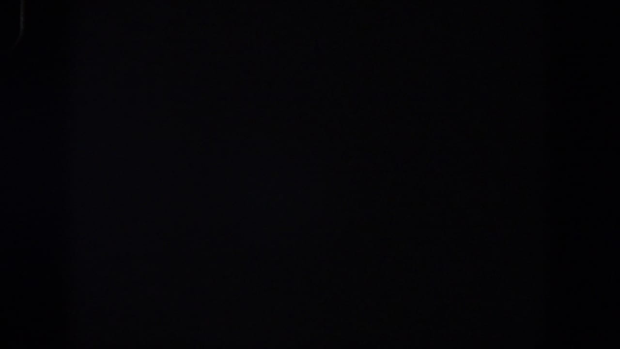 Dark 8mm frame with slight film texture and no visible objects.