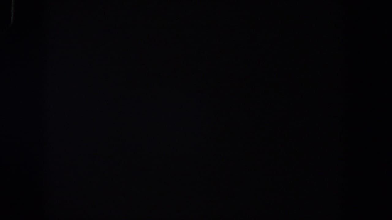Nearly black 8mm frame with no discernible subjects or setting.