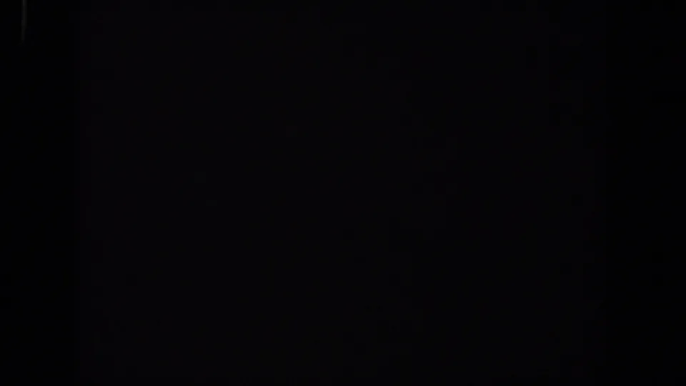 Black final 8mm frame from the Lubbock 1958 metadata, with faint edge marks and no discernible subjects.